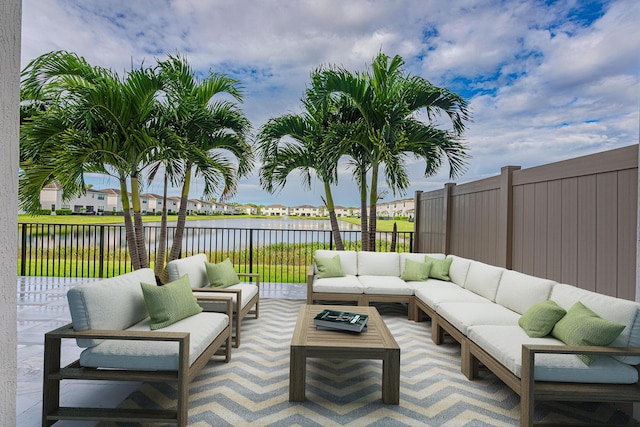 view of patio / terrace featuring an outdoor hangout area and a water view