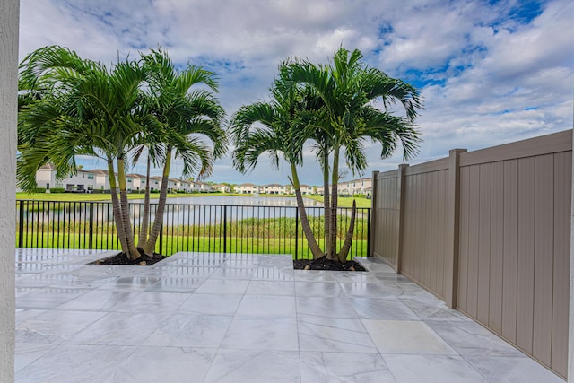 view of patio / terrace with a water view