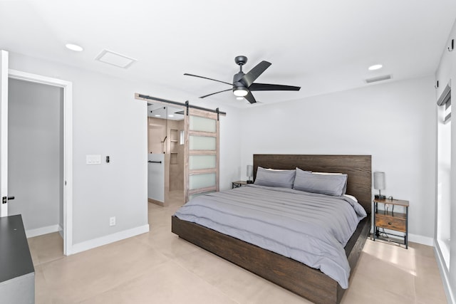 bedroom featuring a barn door and ceiling fan