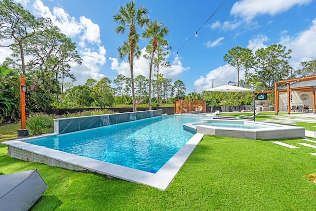 view of swimming pool with a yard, an in ground hot tub, pool water feature, and a patio area