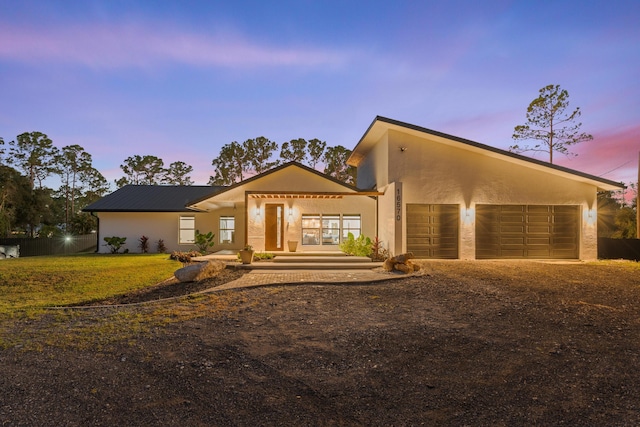 view of front of home with a garage