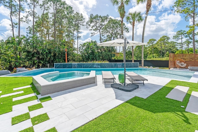 view of swimming pool featuring a patio area, a lawn, and an in ground hot tub