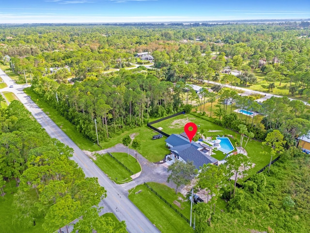 16570 Orange Blvd, Loxahatchee, FL 33470 - aerial view of property and surrounding area with a heavily wooded area and a pool