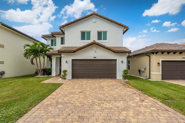 mediterranean / spanish-style home with a garage and a front yard