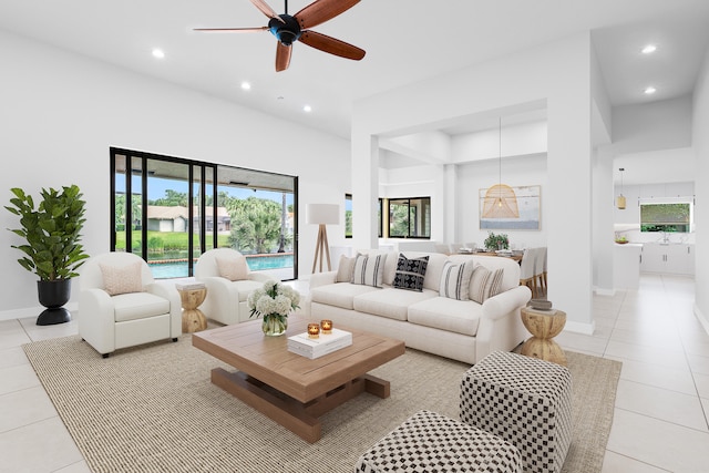 tiled living room featuring ceiling fan