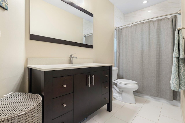 bathroom with tile patterned floors, vanity, curtained shower, and toilet