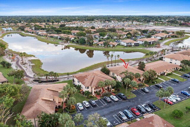 drone / aerial view with a water view