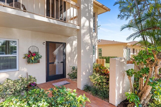 entrance to property with a balcony