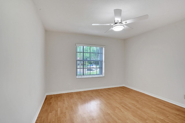 empty room with wood-type flooring and ceiling fan