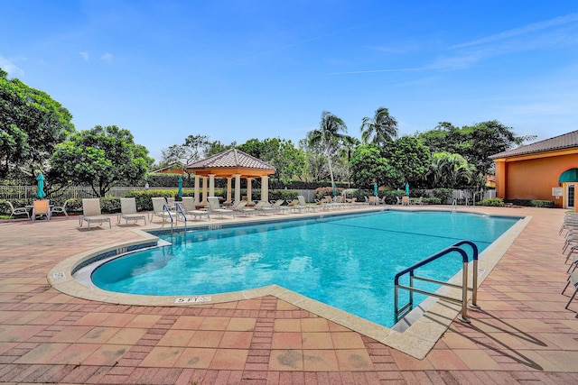 view of swimming pool featuring a patio area