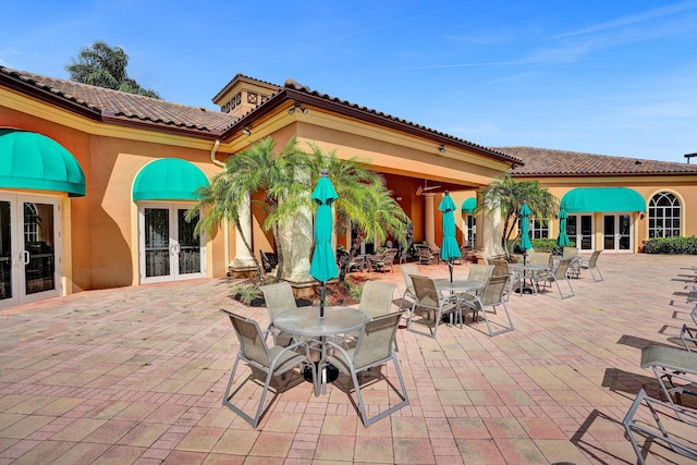view of patio with french doors and outdoor dining space