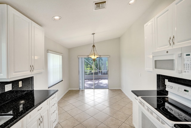 kitchen featuring tasteful backsplash, light tile patterned floors, white appliances, white cabinets, and vaulted ceiling