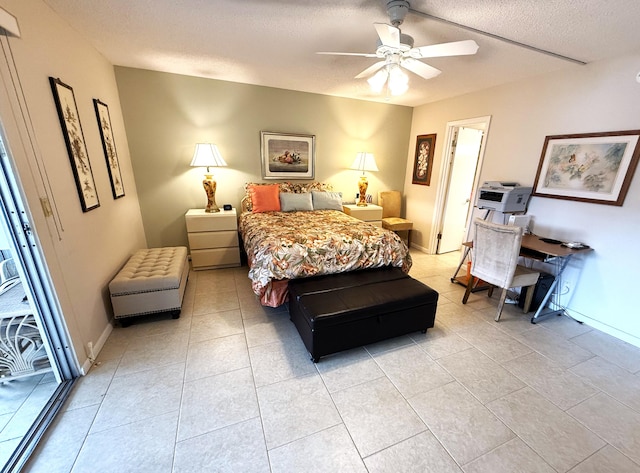 tiled bedroom featuring a textured ceiling and ceiling fan