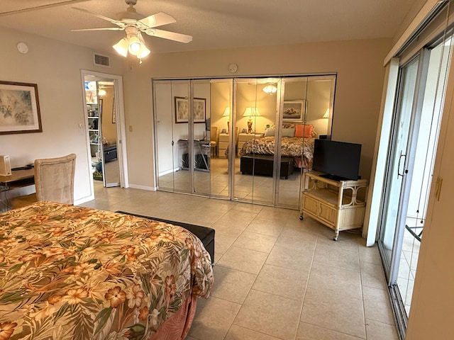 tiled bedroom with ceiling fan