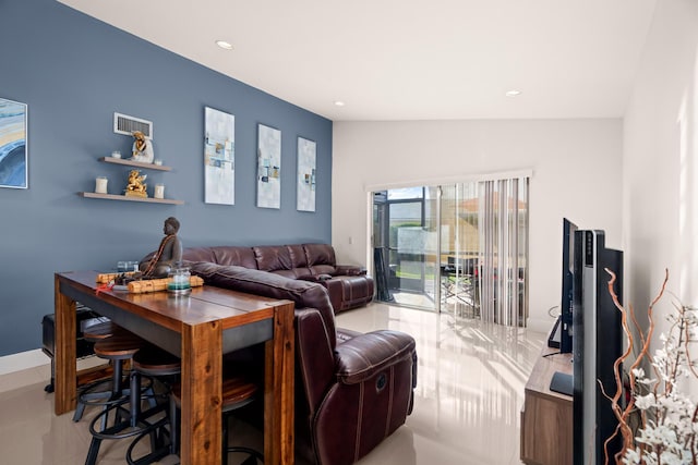 tiled living room with lofted ceiling