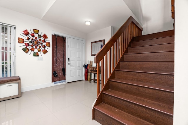 entryway featuring light tile patterned floors