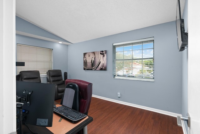 office area featuring a textured ceiling, dark hardwood / wood-style flooring, and vaulted ceiling