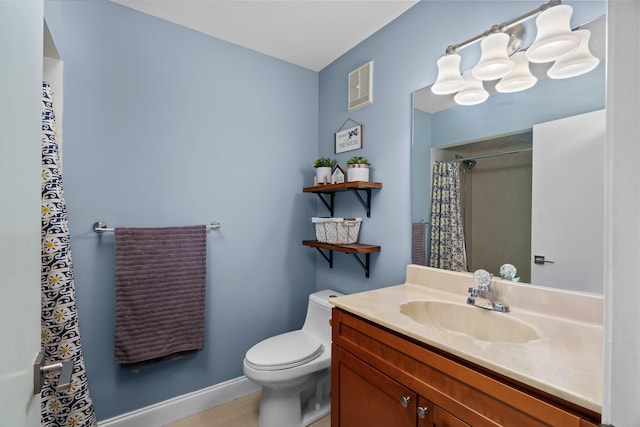 bathroom featuring a shower with curtain, vanity, and toilet