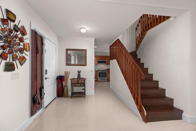 stairs with tile patterned floors