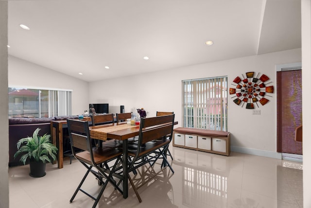 dining space with vaulted ceiling