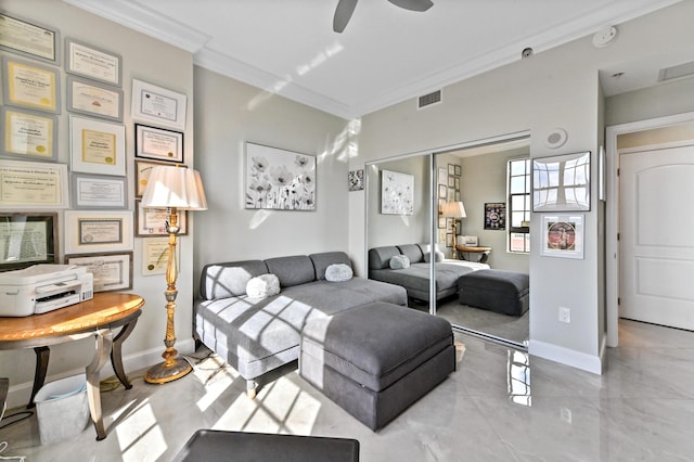 living room with ceiling fan and crown molding