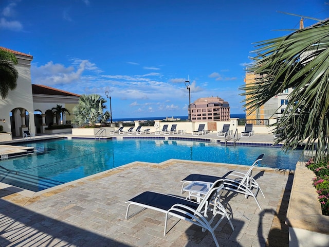 view of pool featuring a patio