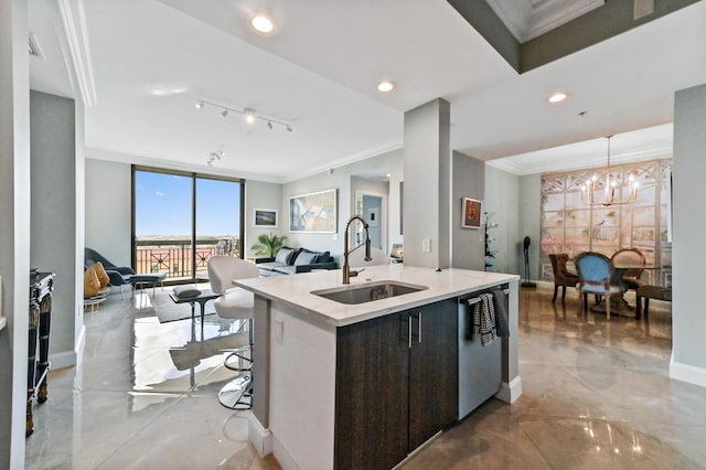 kitchen featuring pendant lighting, a center island with sink, sink, stainless steel dishwasher, and dark brown cabinetry