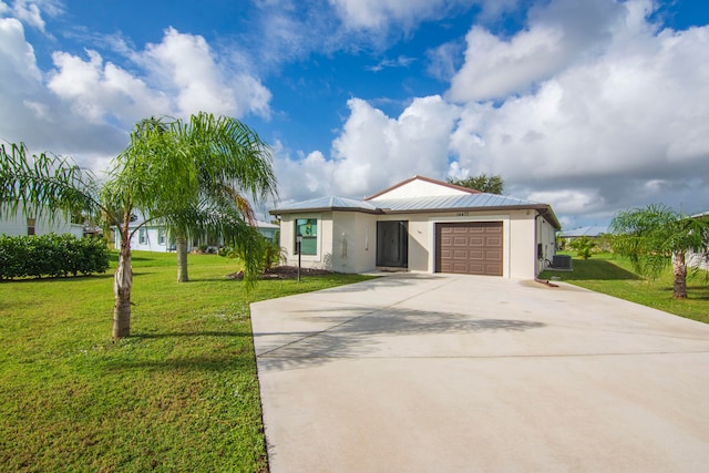 single story home with a garage and a front yard