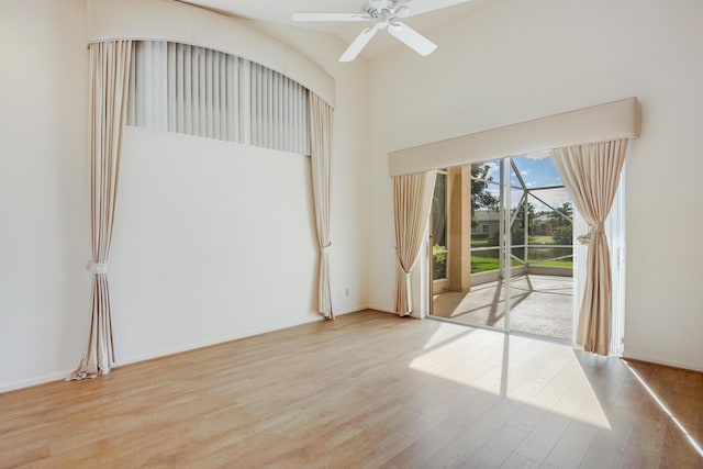 spare room featuring ceiling fan and light hardwood / wood-style flooring