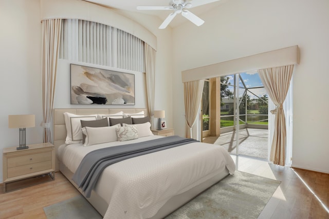 bedroom with access to exterior, ceiling fan, and light wood-type flooring