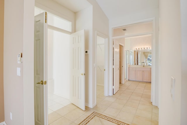 hallway with light tile patterned floors