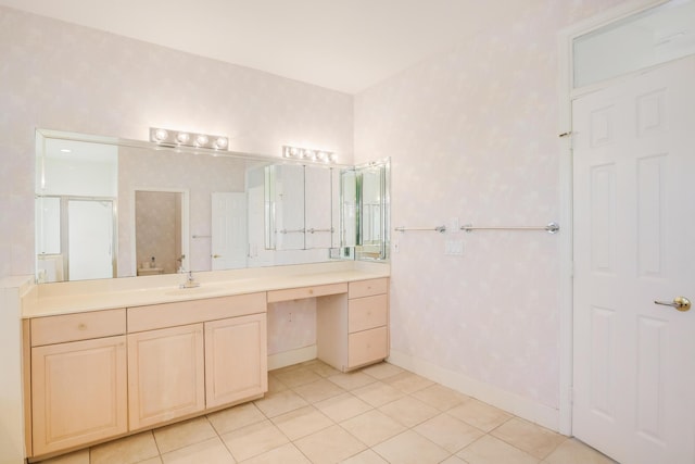 bathroom featuring tile patterned floors, vanity, and a shower with door