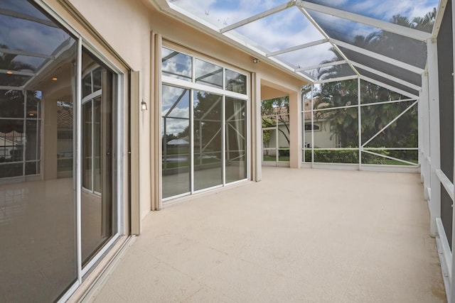 unfurnished sunroom with lofted ceiling