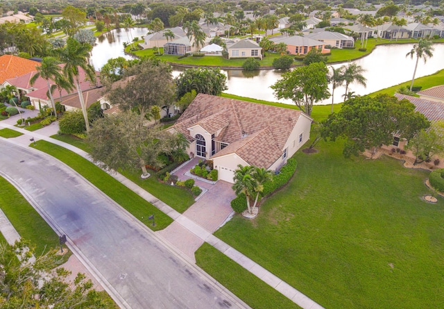 birds eye view of property with a water view