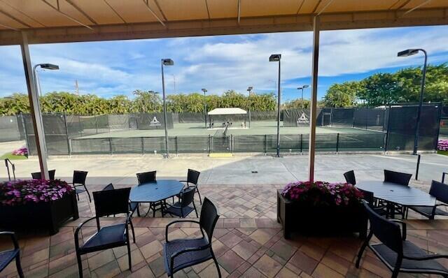 view of patio / terrace featuring tennis court