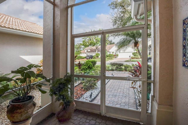 doorway to outside featuring a wealth of natural light