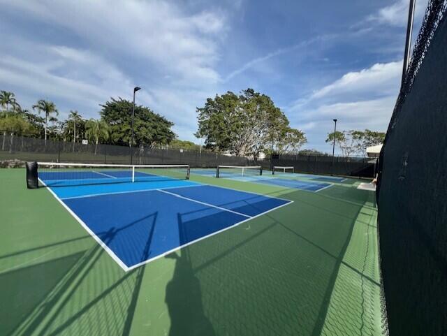 view of tennis court with basketball court