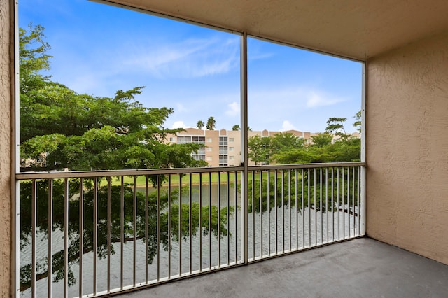 balcony featuring a water view