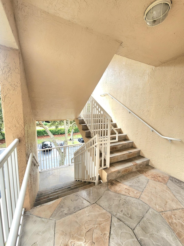 staircase with a water view