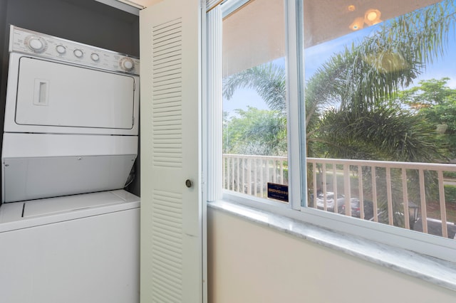 laundry area with stacked washer / dryer