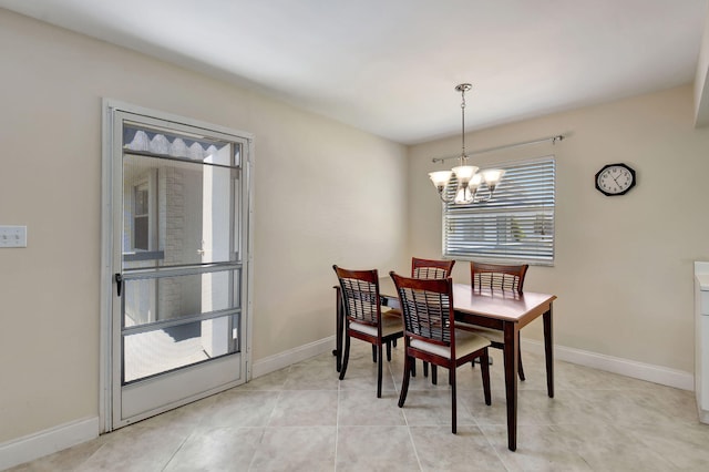 dining room featuring an inviting chandelier and light tile patterned floors