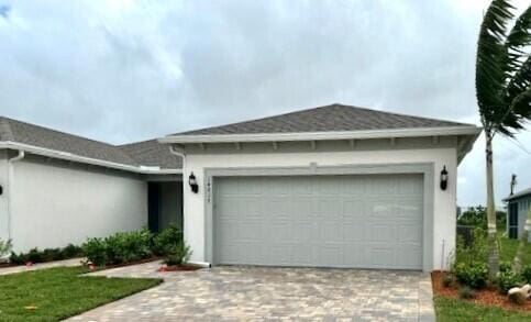 single story home with a garage