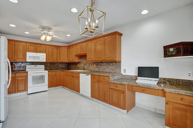 1260 NW 20th Ave Unit 203, Delray Beach, FL 33445 - kitchen with hanging light fixtures, a sink, decorative backsplash, and white appliances