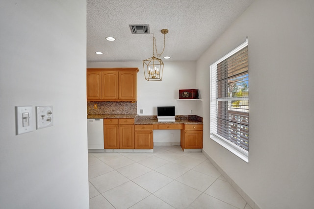 1260 NW 20th Ave Unit 203, Delray Beach, FL 33445 - kitchen featuring a textured ceiling, visible vents, white dishwasher, and a healthy amount of sunlight