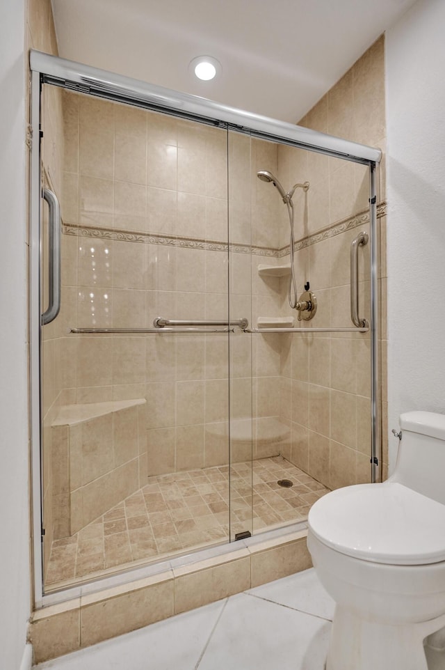 1260 NW 20th Ave Unit 203, Delray Beach, FL 33445 - bathroom featuring recessed lighting, a shower stall, toilet, and tile patterned flooring