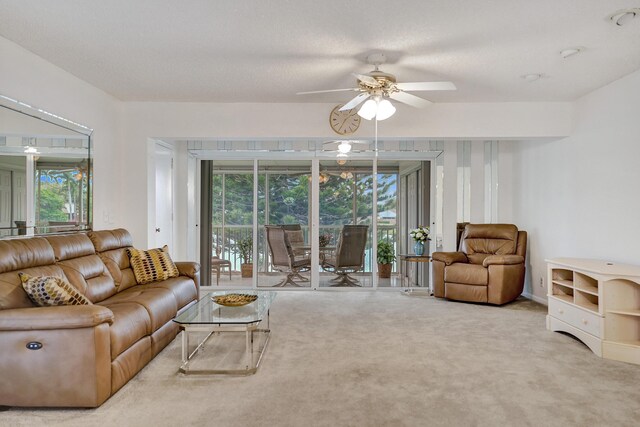 1260 NW 20th Ave Unit 203, Delray Beach, FL 33445 - carpeted living room with healthy amount of natural light and ceiling fan