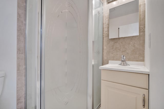 1260 NW 20th Ave Unit 203, Delray Beach, FL 33445 - full bath with toilet, tile walls, a shower stall, and vanity