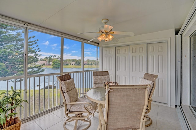 1260 NW 20th Ave Unit 203, Delray Beach, FL 33445 - sunroom featuring ceiling fan, a healthy amount of sunlight, and a water view