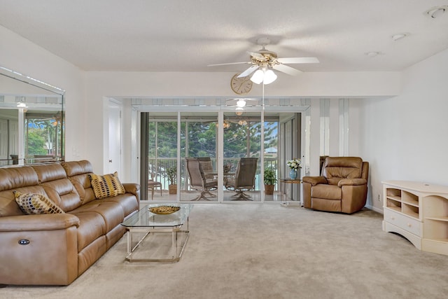 1260 NW 20th Ave Unit 203, Delray Beach, FL 33445 - living area with ceiling fan, carpet, and a healthy amount of sunlight
