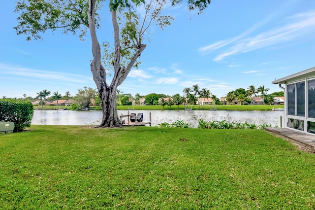 1260 NW 20th Ave Unit 203, Delray Beach, FL 33445 - view of yard featuring a water view, a residential view, and a sunroom